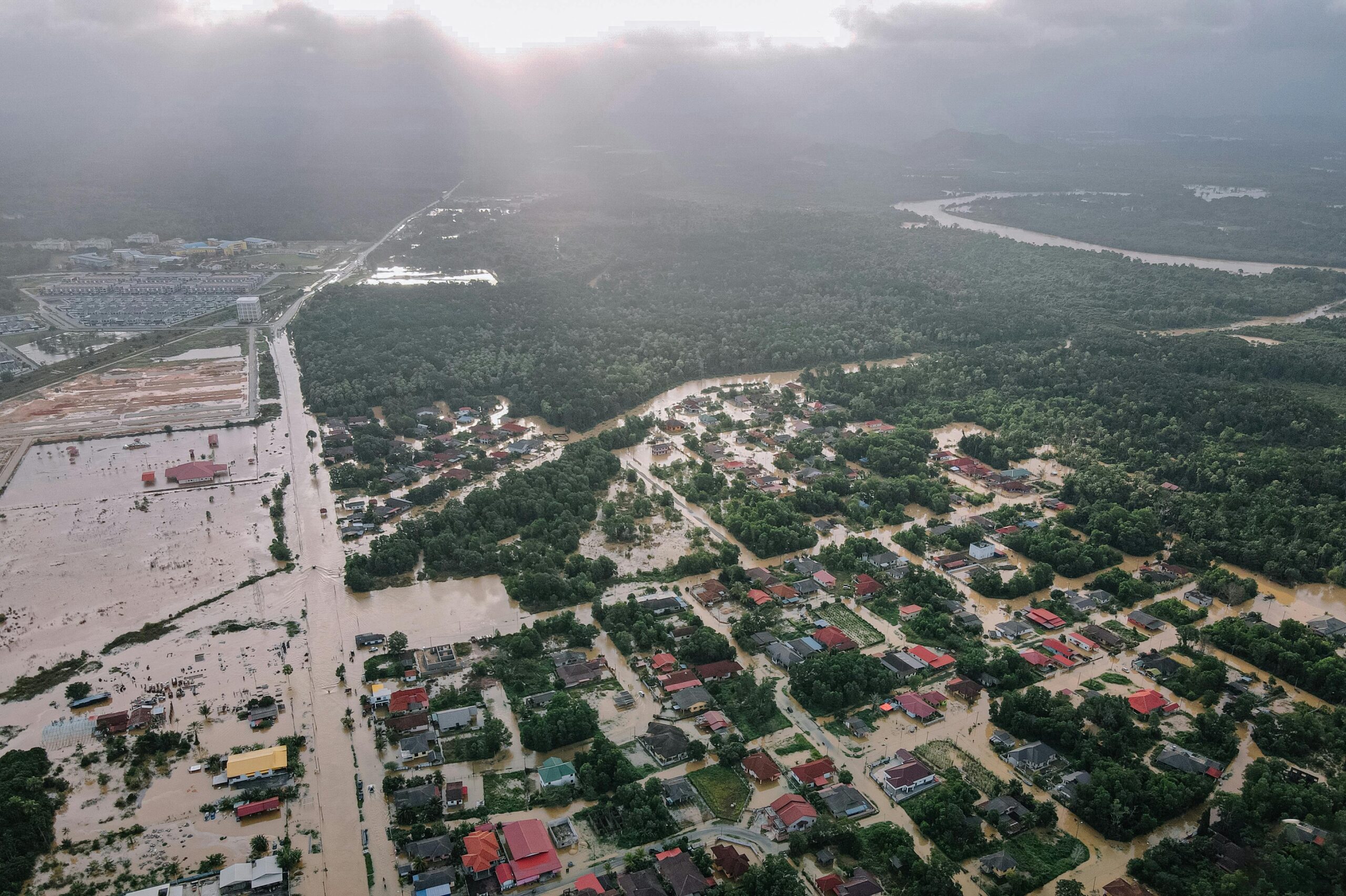 Aerial view of a flooded community showing the need for wide-area IoT networks and resilient communication systems for disaster recovery